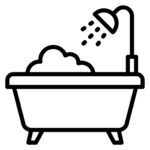 Line drawing of a bathtub with bubbles and a showerhead spraying water above it.